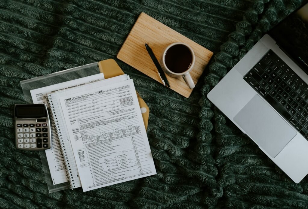 Notebook calculator and laptop for financial planning