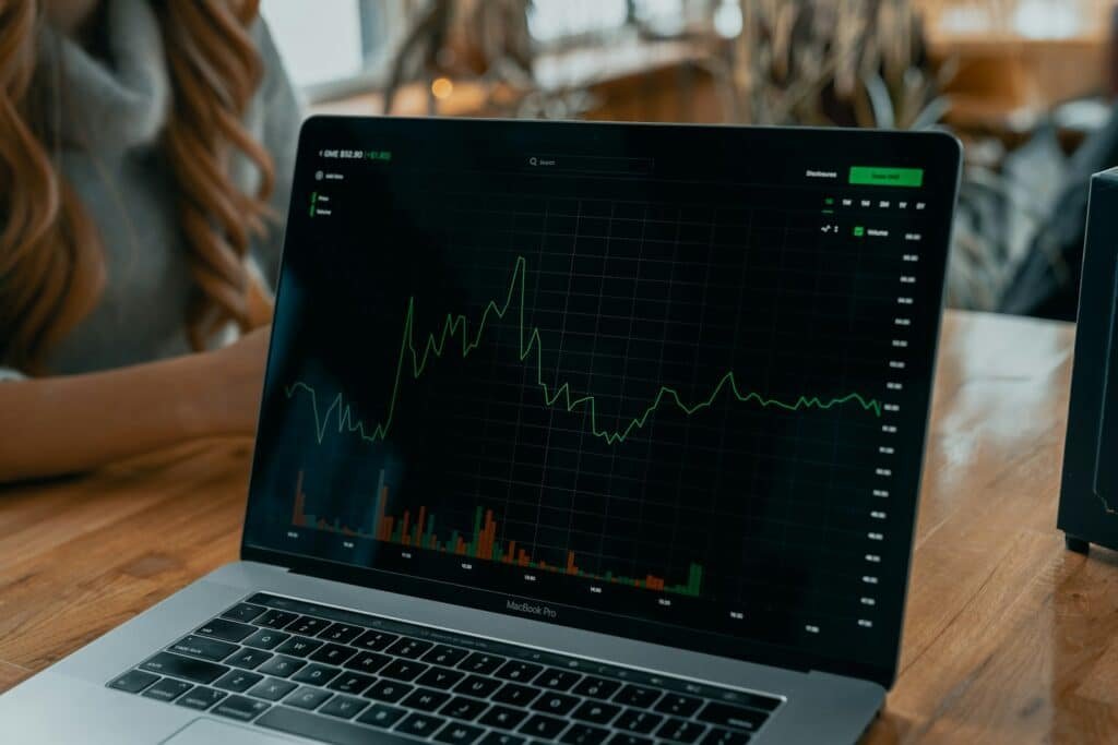 Laptop displaying investment charts for ETF comparison