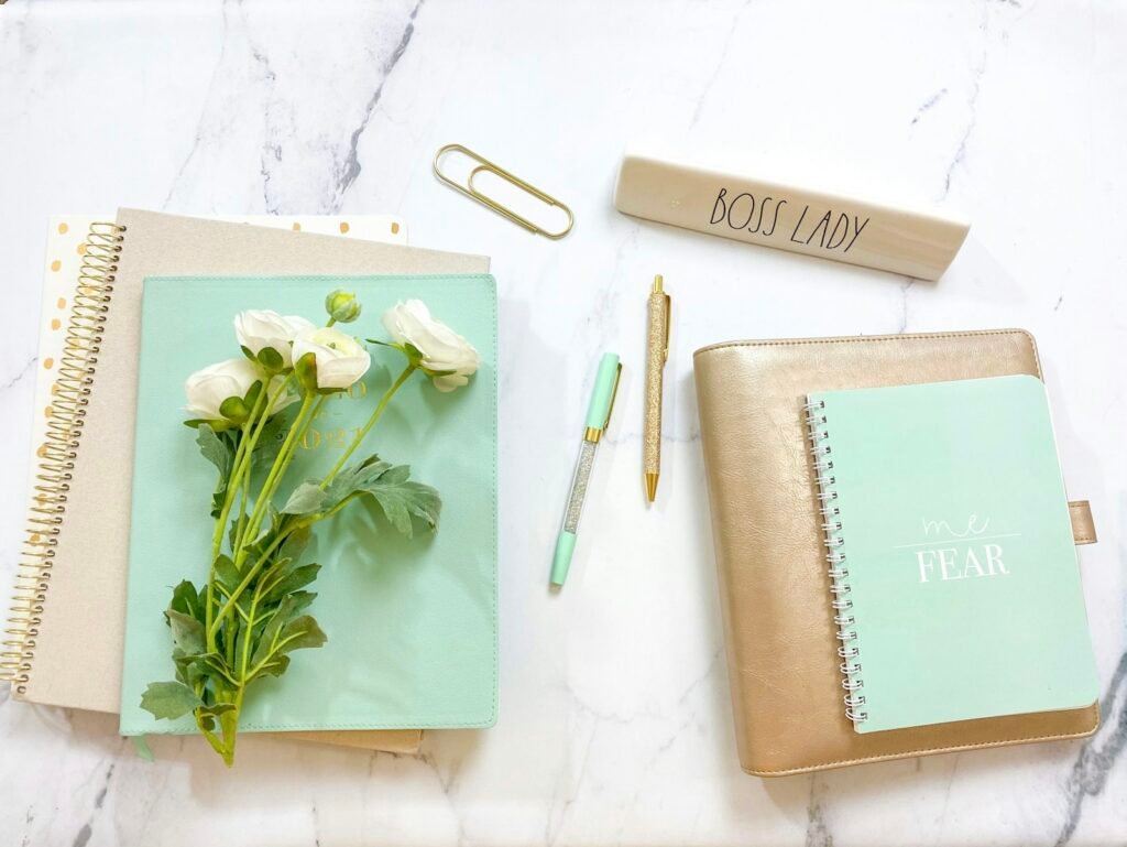 Desk with journal used for financial goal planning