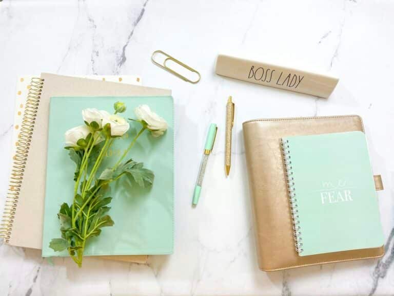 Desk with journal used for financial goal planning