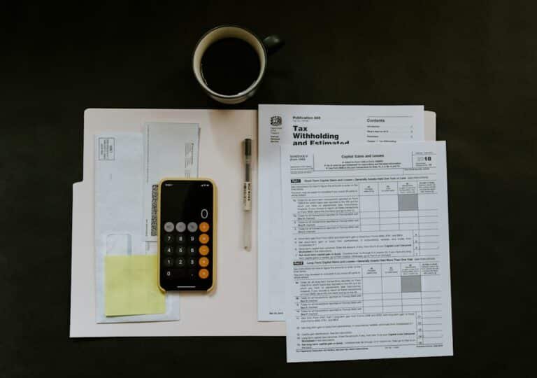 Illustrative financial papers and calculator, not an actual company statement