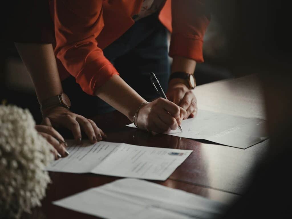 Illustrative photograph of loan paperwork for mortgage interest and EMI education