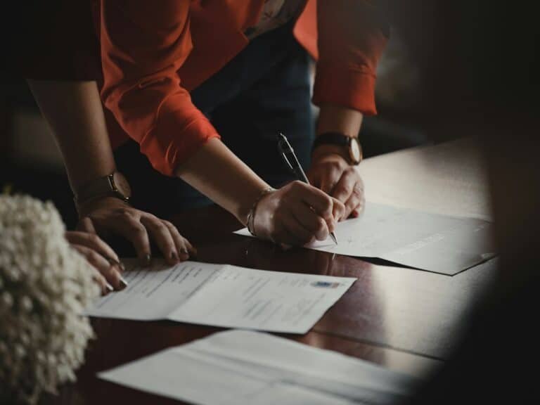 Illustrative photograph of loan paperwork for mortgage interest and EMI education