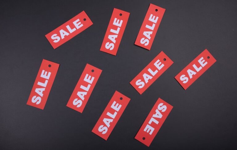 Illustrative photograph of retail sale display, showing business discount promotions